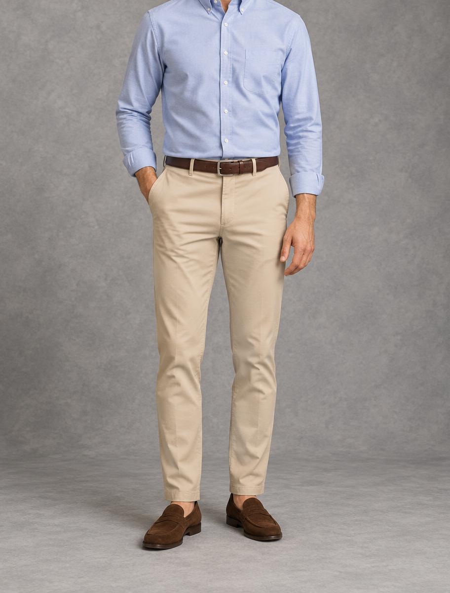 Stone cotton chinos worn with a light blue oxford shirt, brown belt and suede loafers