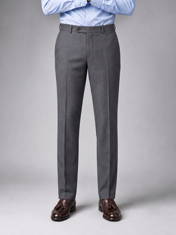 Mid-grey tailored trousers worn with a striped shirt and black shoes